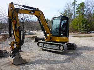 Excavator track adjuster maintenance