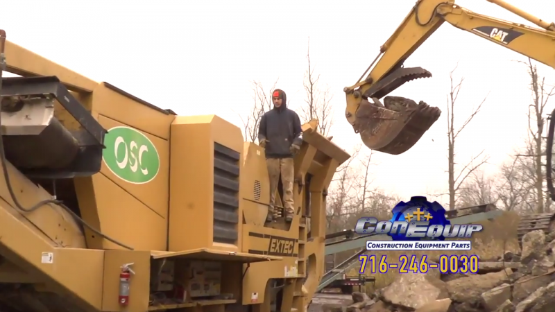 CAT 315CL Excavator Crushing Concrete with an Extec C-12