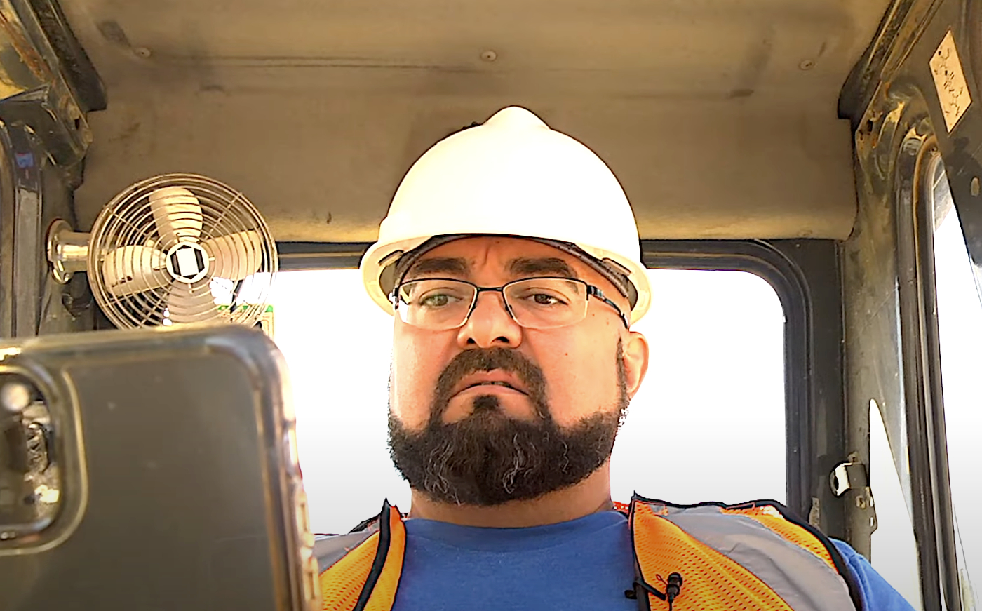 construction worker ordering heavy equipment parts online