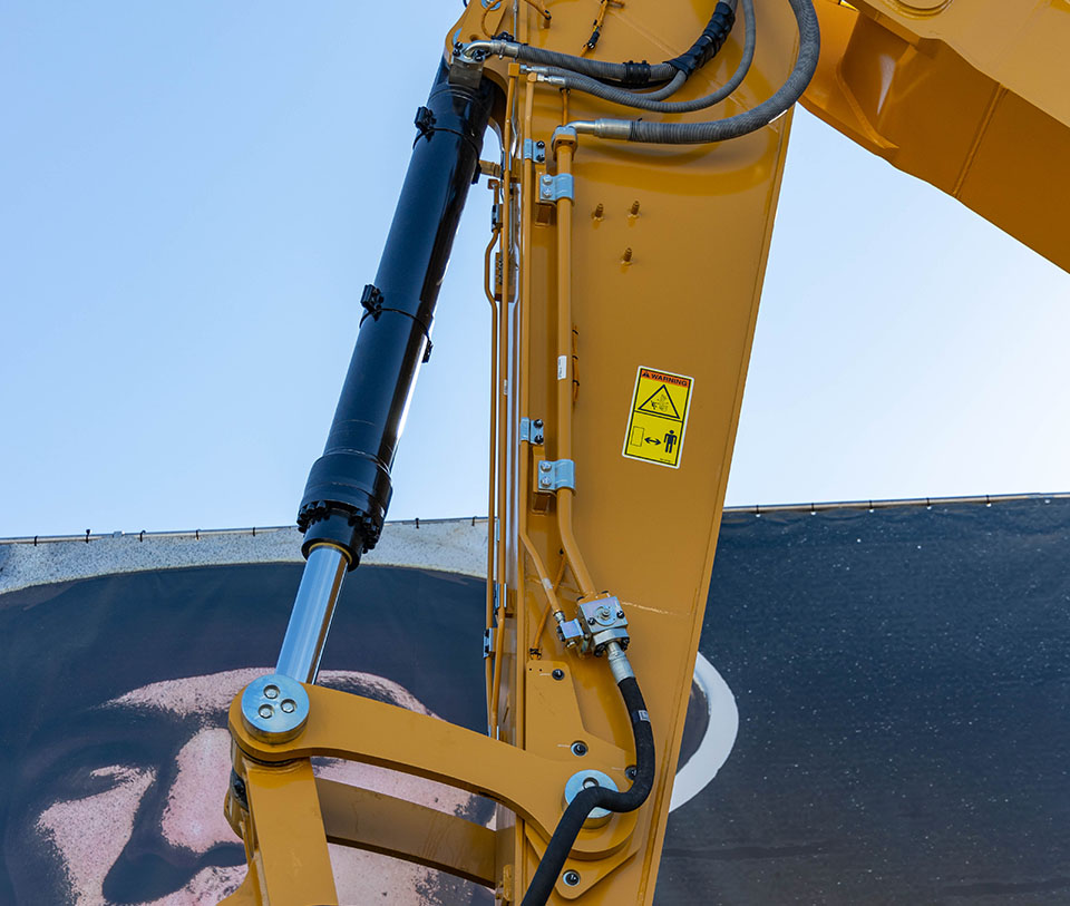 Bucket hydraulic cylinder on Cat Excavator at ConExpo