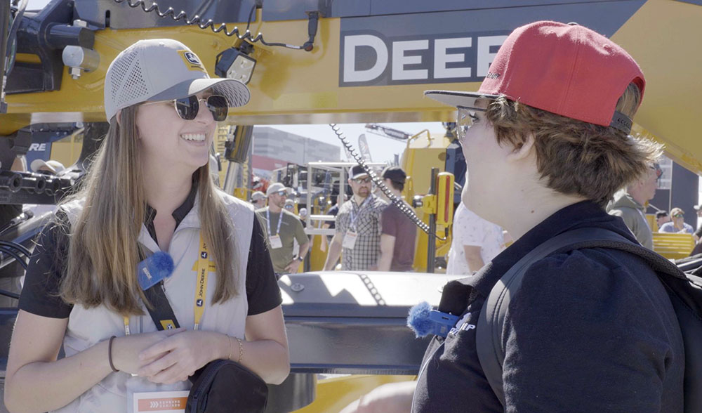 Lauren with John Deere being interviewed about the new P-Tier graders at ConExpo 2026