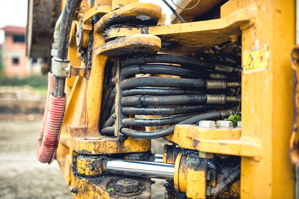 Close up shot of a hydraulic system on an excavator