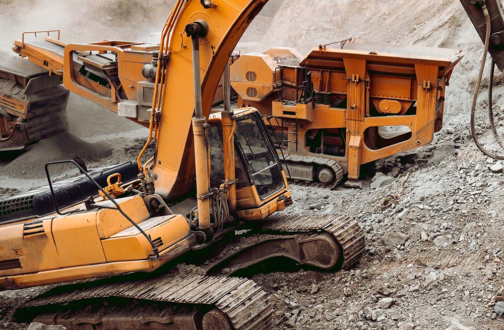 Boom cylinder on an excavator working in a quarry