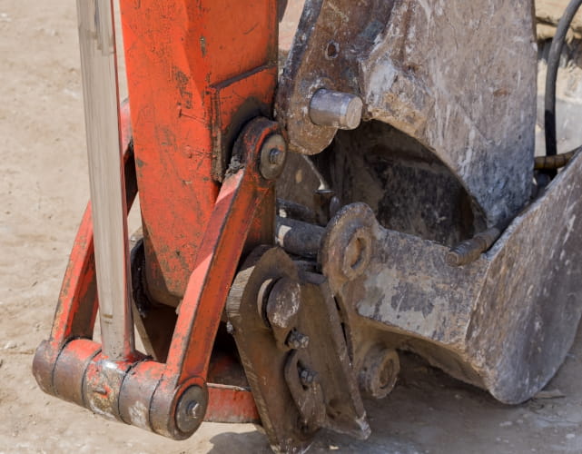 greasing heavy equipment pivot point